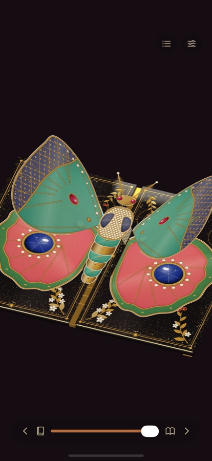 iPhone: a lacquered pop-up book with a paper moth, its forewings lifted to show two sapphire eyespots